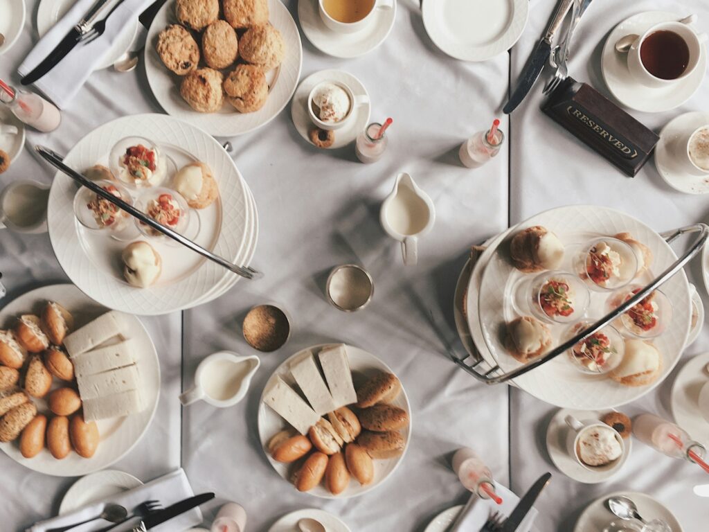 Flat layer of high tea food on table